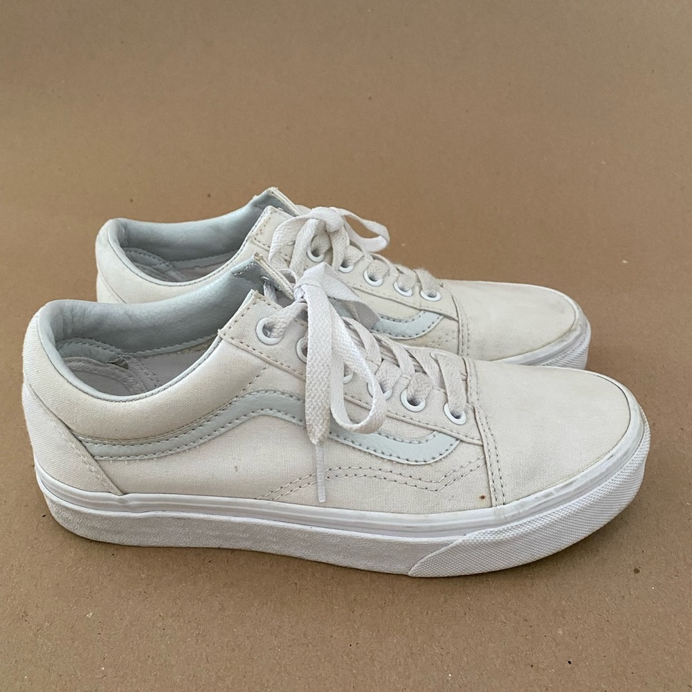 All-white Vans Old Skool sneakers